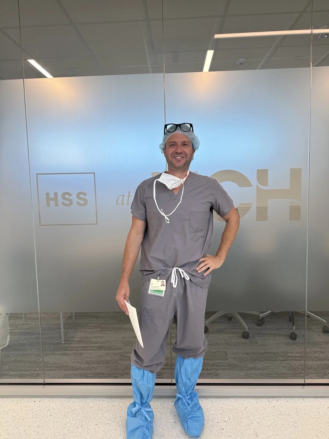 Dr. Brian Wallace in surgical scrubs at HSS at NCH in Naples